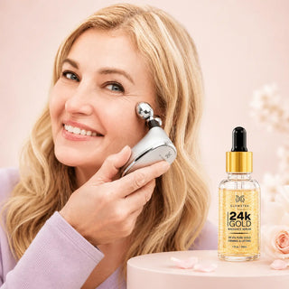 Woman using a skincare device with a bottle of 24K gold serum on a pink background