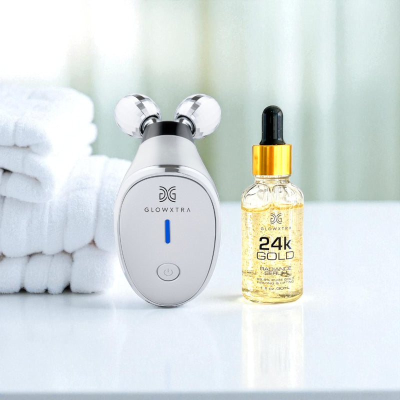 Glowxtra skincare device and 24k gold serum on a white surface with towels in the background
