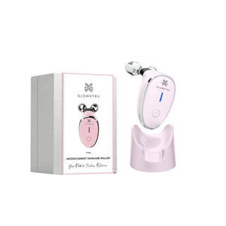 GlowXtra pink microcurrent facial roller with charging stand and retail box on white background